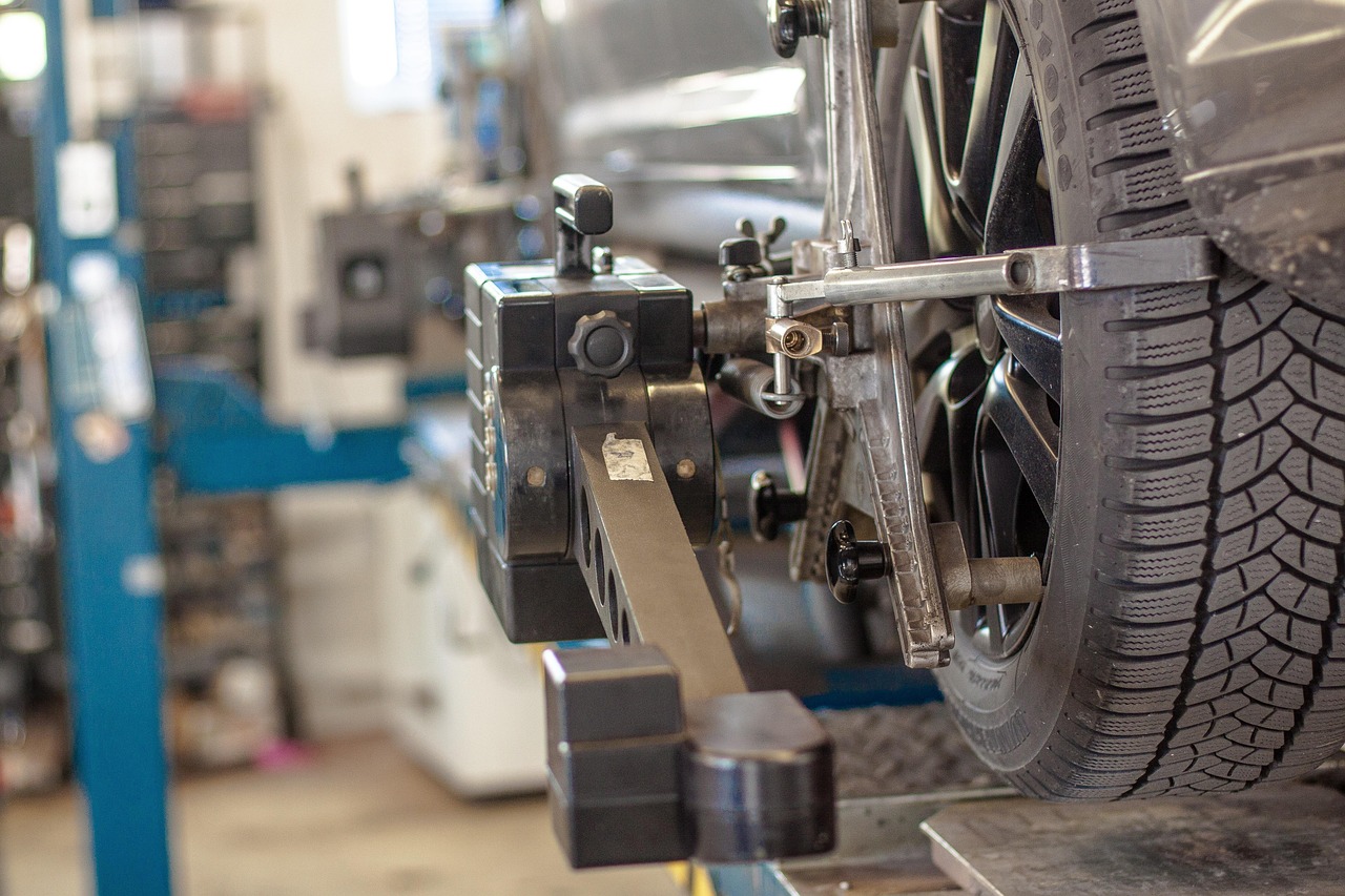 car lift and wheel alignment equipment in automotive workshop
